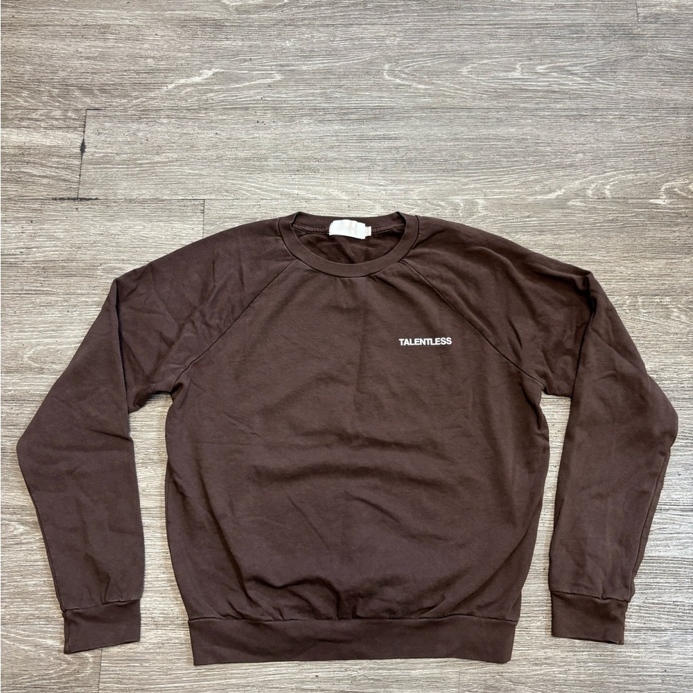 Talentless crewneck sweatshirt featuring a relaxed fit and a small white logo